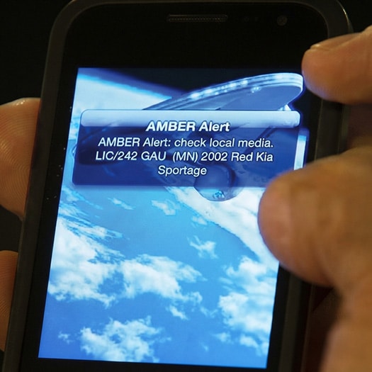 Smartphone with an AMBER Alert on its screen