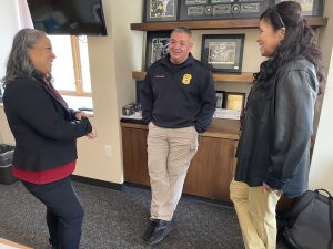 Oneida Nation Police Chief Eric Boulanger, center, meets with the AATTAP/AIIC team Tyesha Wood, left, and Valerie Bribiescas.
