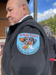 Menominee Tribal Police Chief Keith Tourtillott wears his jacket badge with honor.