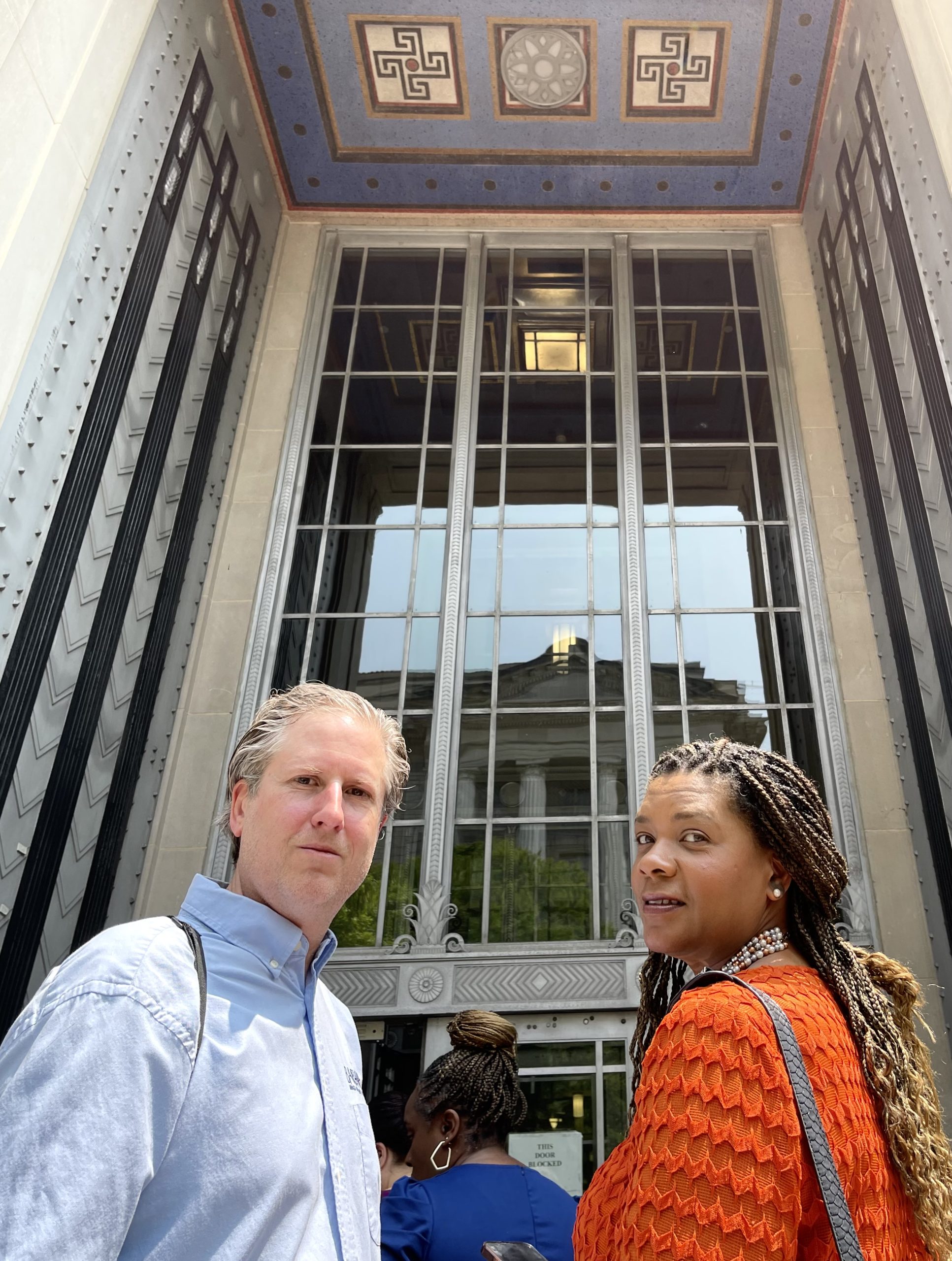 Photo of Jeffery Morehouse and Dr. Noelle Hunter outside the U.S. Department of Justice in Washington, D.C. (May 2023)