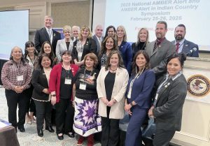 Symposium guest speakers Pamela Foster (front row center), Marlys Big Eagle (front row, second from right), and Kimber Biggs (second row, second from left). Also shown (at top left) is Brad Russ, Executive Director of the National Criminal Justice Training Center of Fox Valley Technical College. {Photo credit: AATTAP}