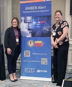 AMBER Alert Coordinators Janell Twardowski of Minnesota (left) and Melissa Marchant of Wisconsin pose for a photo. {Photo credit: AATTAP}