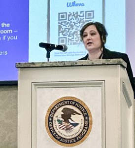 AMBER Alert Training &amp; Technical Assistance Program Administrator Janell Rasmussen speaks to more than 200 Symposium attendees. {Photo credit: AATTAP}