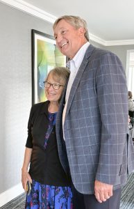 14. NCJTC Executive Director Brad Russ (right) shares a hug with parent survivor and longtime advocate for missing children, Patty Wetterling, during the AATTAP reception.