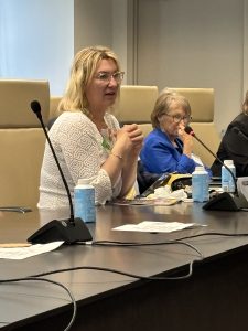 Photo of sibling survivor Heather talking at the Family Roundtable Discussion at OJJDP headquarters in 2024