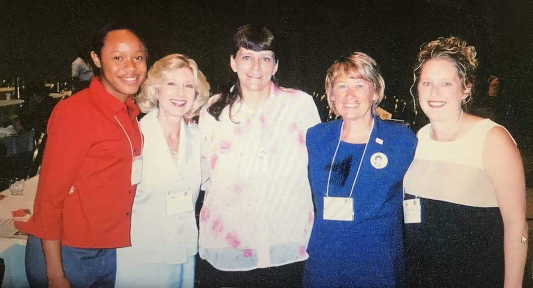 Photo showing Patty Wetterling (second from right), Janell Rasmussen (far right), Donna Norris (mother of Amber Hagerman, center), U.S. DOJ Assistant Attorney General Deborah J. Daniels (second from left), and abduction survivor Tamara Brooks (far left) at the first national AMBER Alert Conference in 2003.