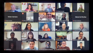 Photo of a computer screen showing 25 squares with a person or name of someone attending a virtual meeting.