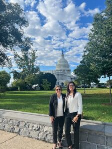 Photo of two women standing near the U.S. Capitol.