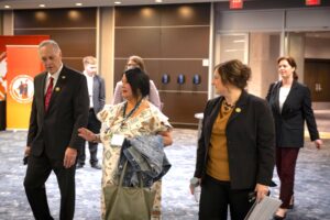 Arizona Congressman Andy Biggs, walks with Pamela Foster (mother of Ashlynne Mike), and Janell Rasmussen, NCJTC Director/AATTAP Administrator at the 2025 National AMBER Alert & AMBER Alert in Indian Country Symposium in Washington, DC