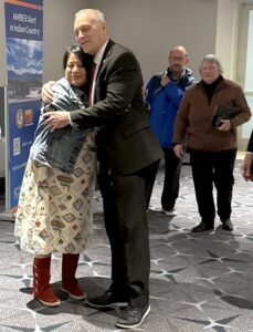 Pamela Foster, mother of Ashlynne Mike, gets a hug from U.S. Congressman Andy Biggs of Arizona at the 2025 National AMBER Alert & AMBER Alert in Indian Country Symposium in Washington, DC