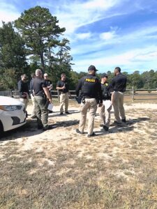 group of police officers in a field