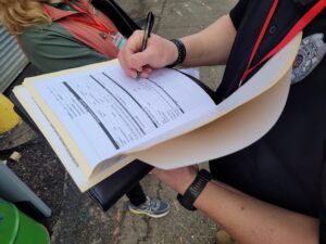 man filling out a paper form