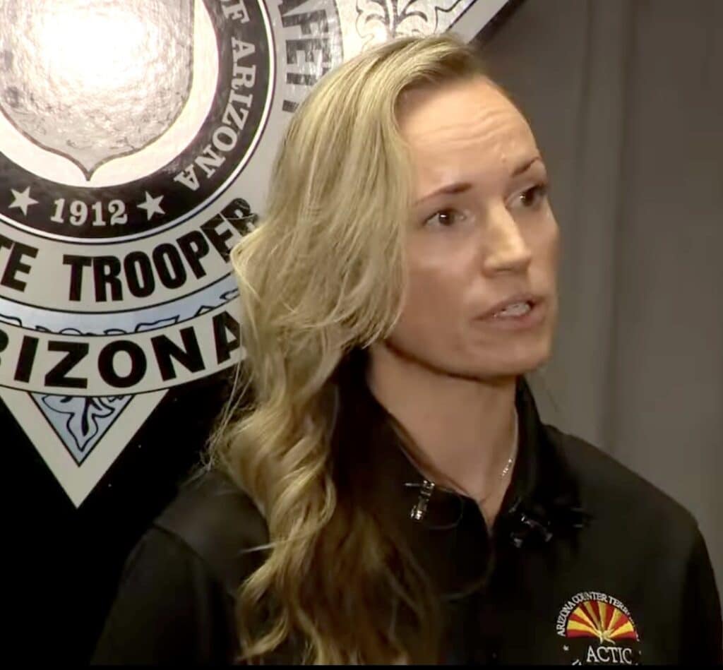 Woman speaking in front of an Arizona Department of Public Safety