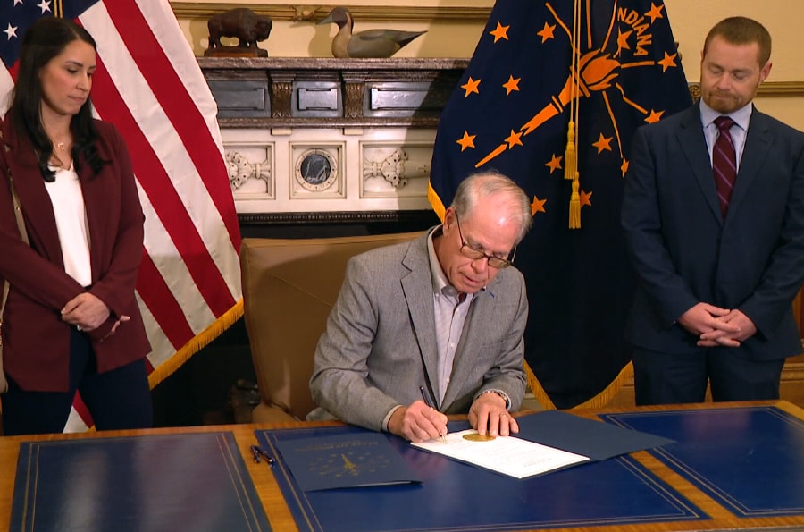 Indiana Governor Mike Braun signing a bill into law