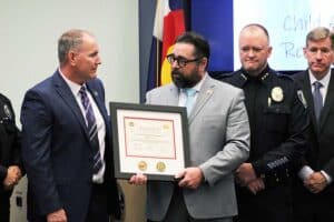 Derek VanLuchene presenting DOJ CART Certificate to North Central Colorado Regional CART