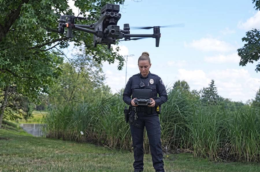 Police officer flying a drone