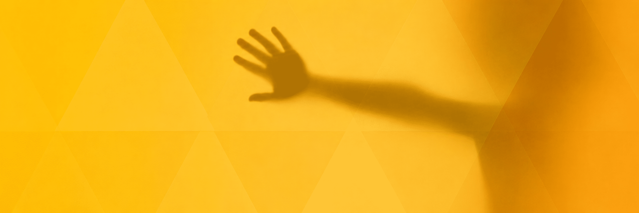 Shadow of a child's hand behind opaque glass