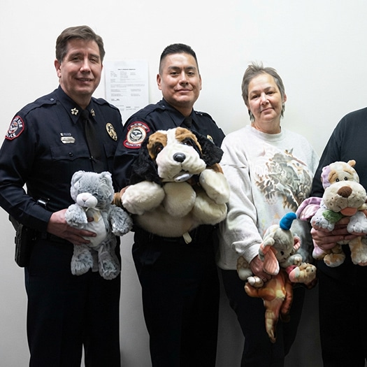 Isleta Pueblo Police Chief KevinMariano, center, at a charity event