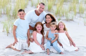 Victoria Martuscello and her family on a beach.
